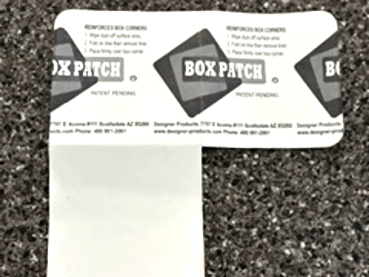 A strip of Box Patch patches with the backing liner folded out